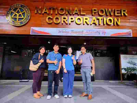 Pearl Electric engineers pose for a photo with staff from the National Power Corporation (NPC) of the Philippines.jpg